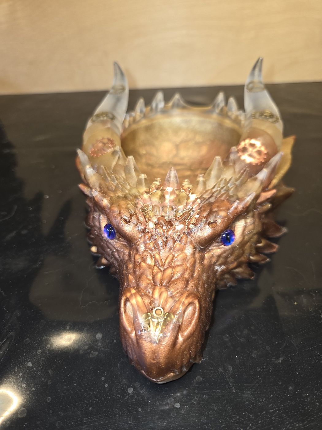 Steampunk dragon head in bronze with galaxy purple eyes