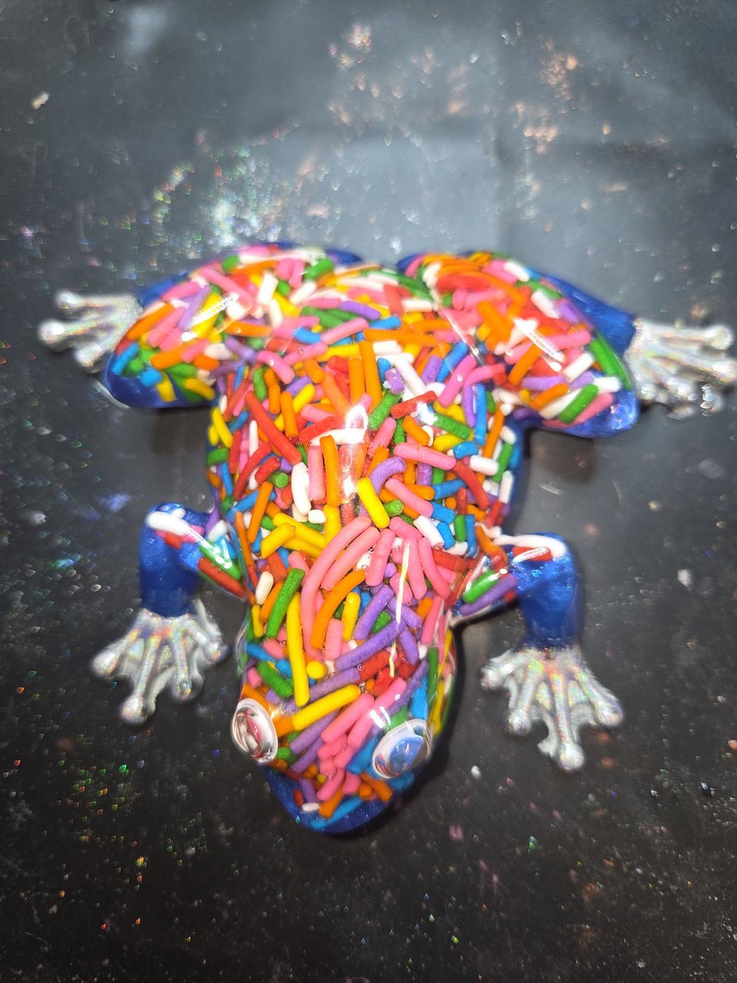 Resin frog packed with rainbow sprinkles