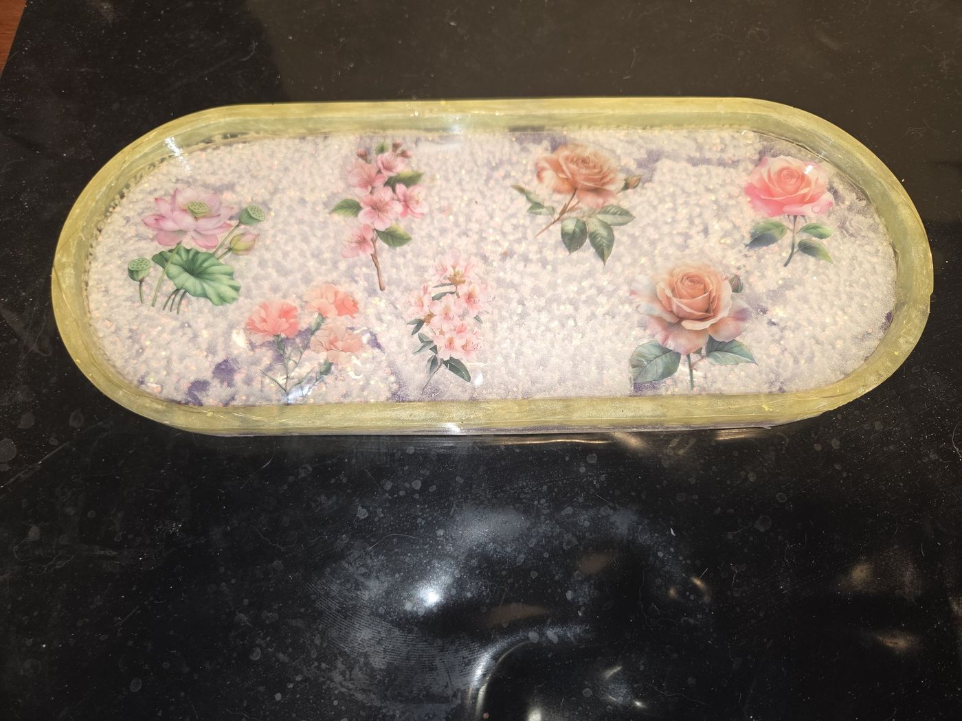 Oval gold-rimmed tray with pink florals on white glitter